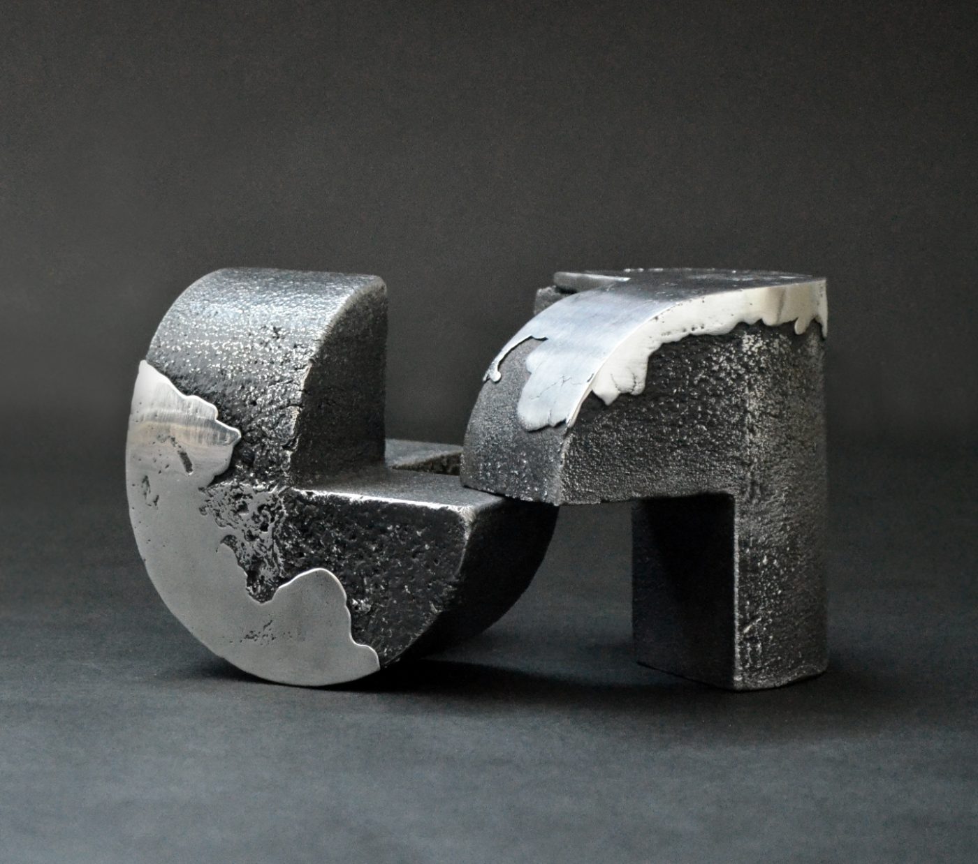 Cast aluminum sculpture — rough and polished surfaces